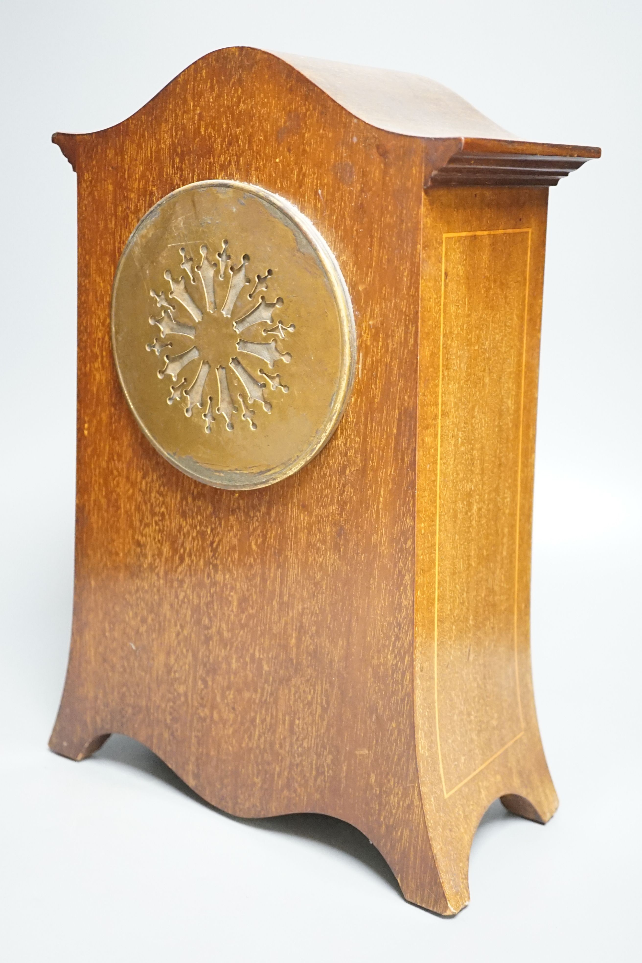 An Edwardian inlaid mahogany mantel clock with French gong-striking movement, 39cm.